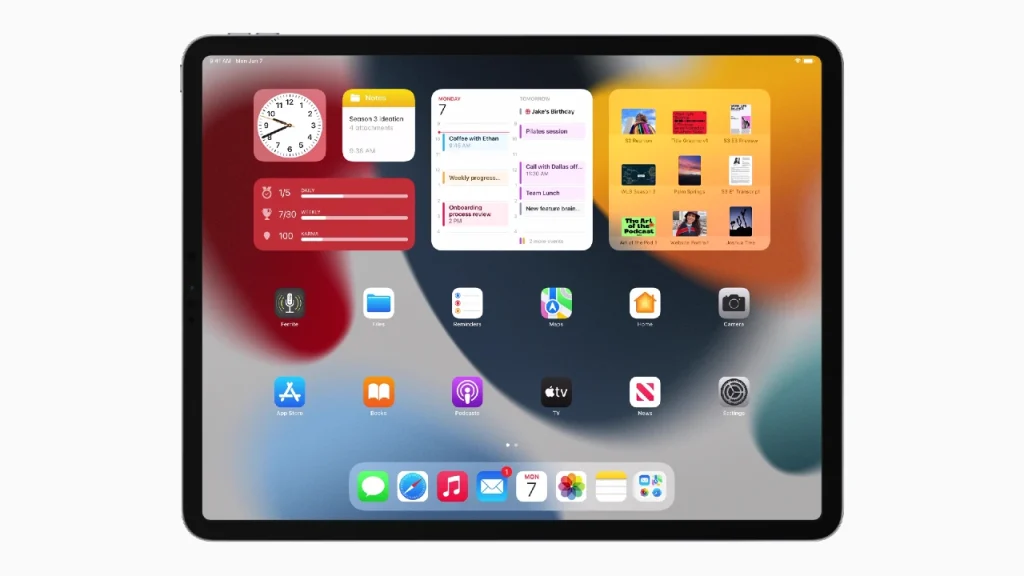 Pantalla de inicio de iPad con aplicaciones y widgets.